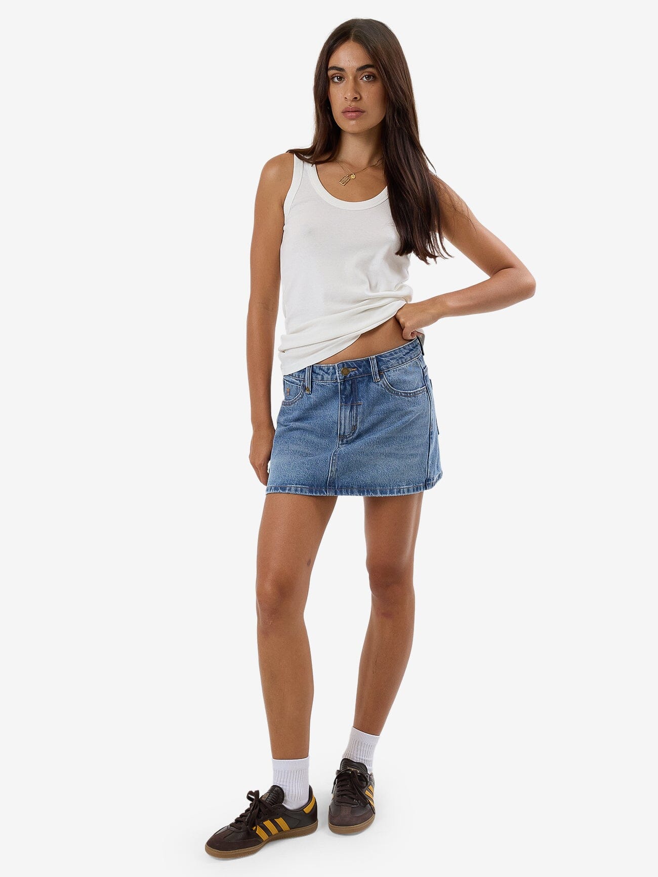 Female model wearing our Thrills Sophie Skirt in Blue standing against a plain studio background.