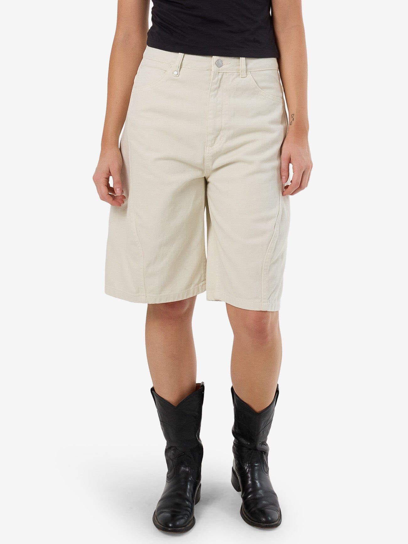 Female model wearing our Thrills Ronnie Short in White standing against a plain studio background.