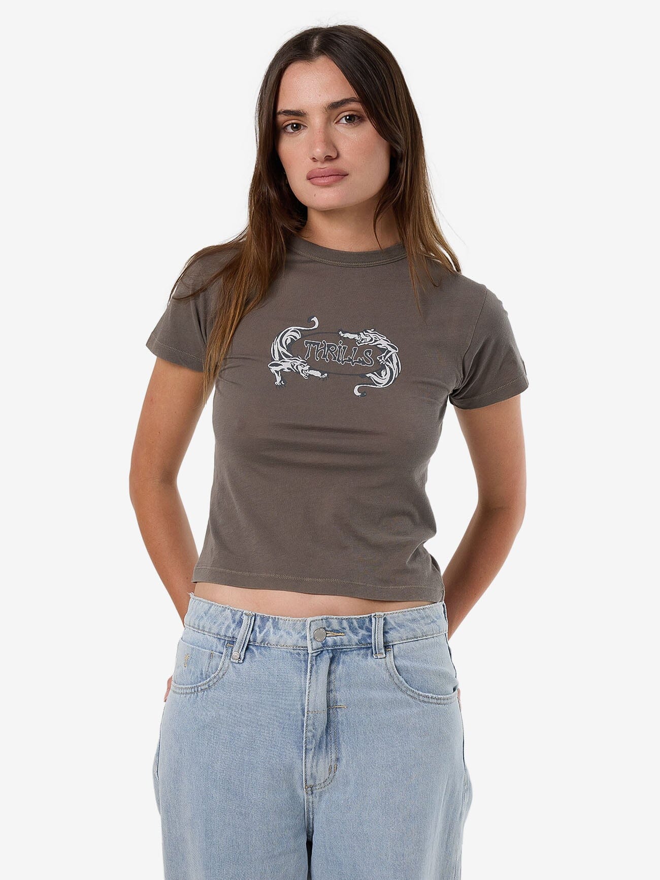 Female model wearing our Thrills Decisions Boy Tee in Grey standing against a plain studio background.