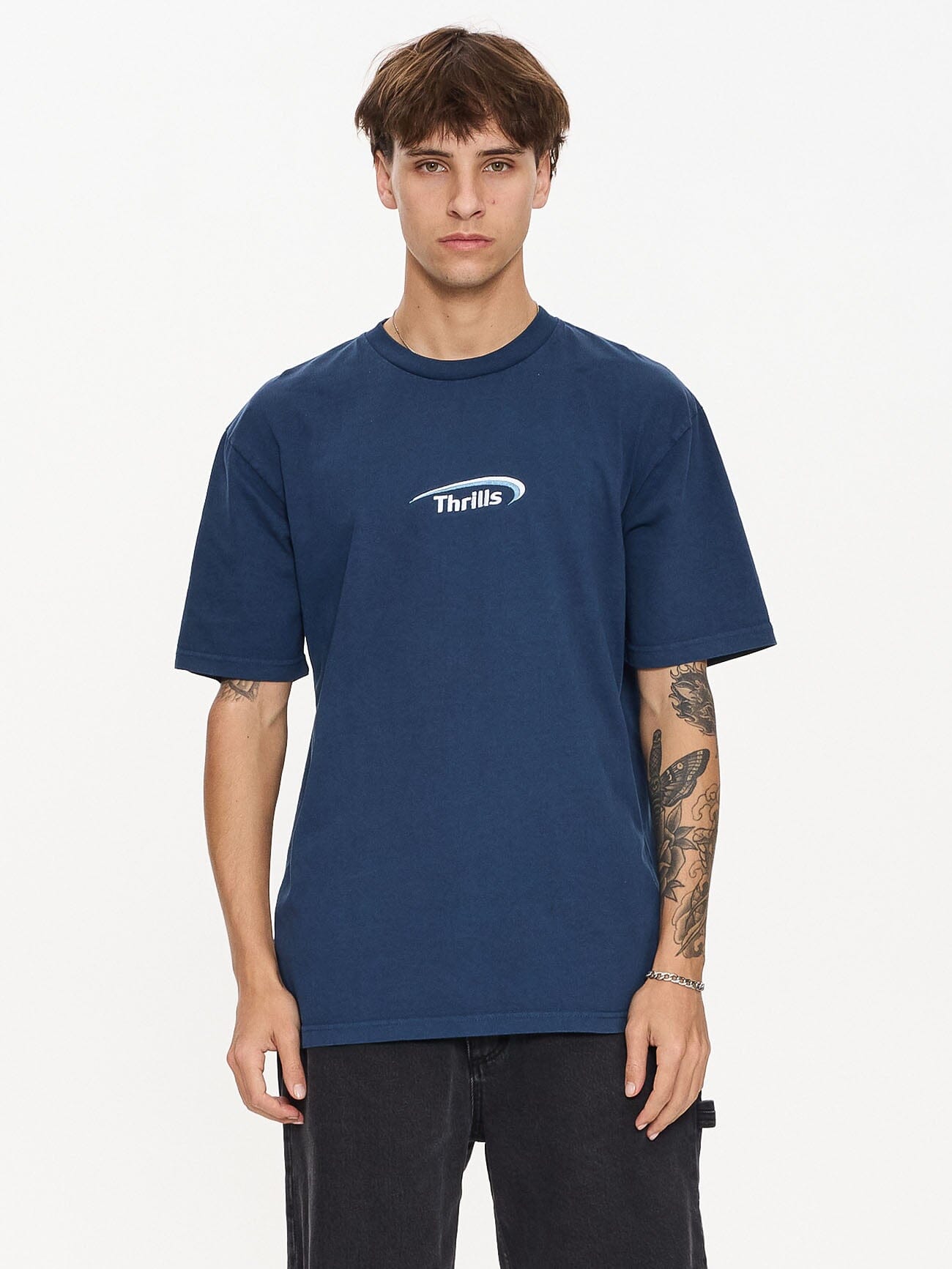 Male model wearing our Thrills  standing against a plain studio background.